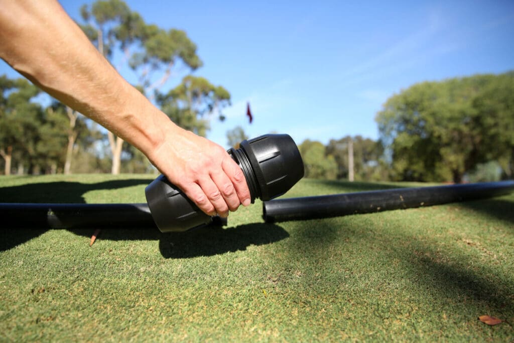 Philmac irrigation fitting installed on a field system to support efficient water flow.